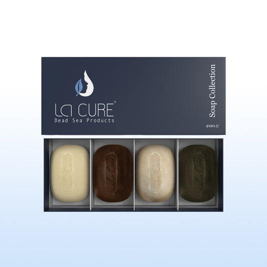 Set of four soaps in a LCI Cure packaging on a light blue background