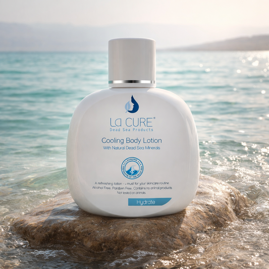 La Cure Cooling Body Lotion bottle on a rock with ocean background